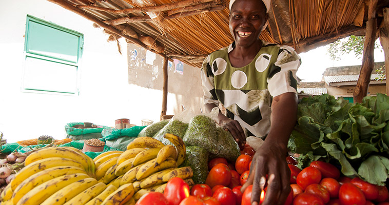 Mary started growing tomatoes in 2010 and now operates her own stand at her local market in Homa Bay County.