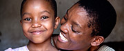 Photo of a woman and girl smiling