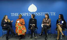 Photo of five people on a panel with the logo of the Aspen Institute on the wall behind them