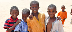 A group of boys smile at the camera