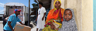 Mother Nasra Ally and child are waiting outside a clinic in the Northern Zonal Area of Tanzania’s Dar es Salam 