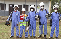 People wearing protective suits, breathing masks and helmets