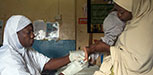 A nurse is taking a blood sample for dry blood test for HIV from a child in Minna, Niger state