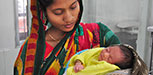 A woman holds her child at the hospital
