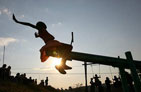 Photo of a young girl playing on the see-saw.