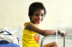 Photo of a smiling young TB patient in the hospital