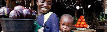 Jessica Scranton, FHI 360. Mother and child in a market in Zambia