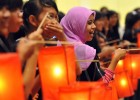 Indonesian youth hold lanterns during a candle-light vigil to mark World AIDS Day in Jakarta Dec. 1, 2009. More than 30 million 