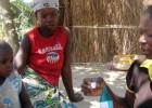 Community health worker Rosalina Casimiro meets with children in Nampula province, Mozambique, to demonstrate how to purify wate