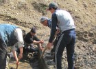 Young men from Zulpuev municipality clear the irrigation canal so thousands of farmers can receive water to maintain their crop 