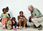 Anthony Lake converses with a family outside a health center in Ethiopia in June 2009, before taking up his post with UNICEF, as
