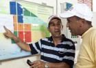 Mohammed Azzimani compares the irrigation guidance he receives from USAID with standard guidance. 