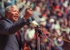 Anti-apartheid leader and African National Congress member Nelson Mandela speaks at a funeral for 12 people who died during town