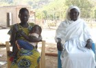 Suzanna Ile and her son Modi at the USAID-supported Lokiliri Primary Healthcare Centre, with the community midwife who helped en