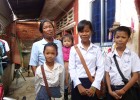 Miean Keng and her grandchildren, ready for school