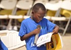A child reads to the audience during Ghana’s reading festival in Cape Coast.