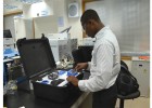 A Ghanian technician in Accra uses PharmaChk to test malarial drug quality.