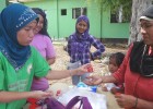 Informal laboratory workers in Basilan get supply of sputum cups for distribution to community members with TB symptoms.