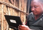 A USAID-trained enumerator uses a tablet to collect information for a Feed the Future baseline survey.