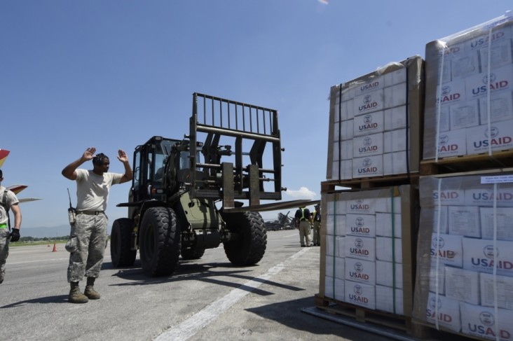 Tech. Sgt. Ronald Rowe, 621st Contingency Response Wing, facilitates transport of USAID food and provisions.