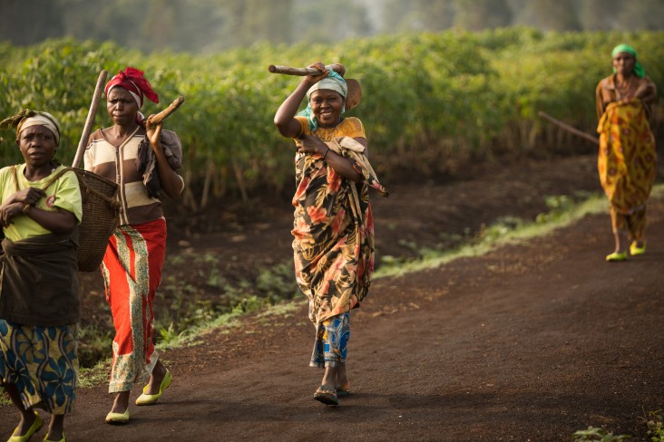 women walking through a field