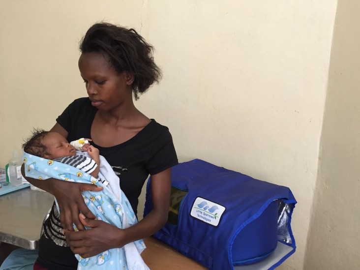 A mother in her Burundi holding her newborn after treatment. Her baby arrived at the hospital at three days of age with critically high Bilirubin levels