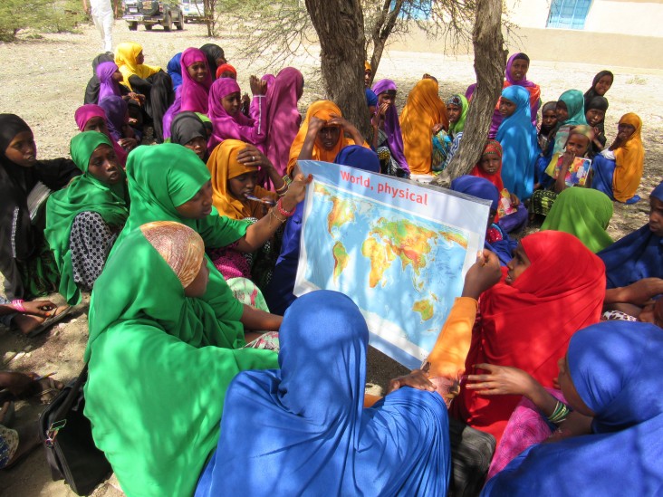 Pastoralist children learning to read using ABE distributed literacy materials