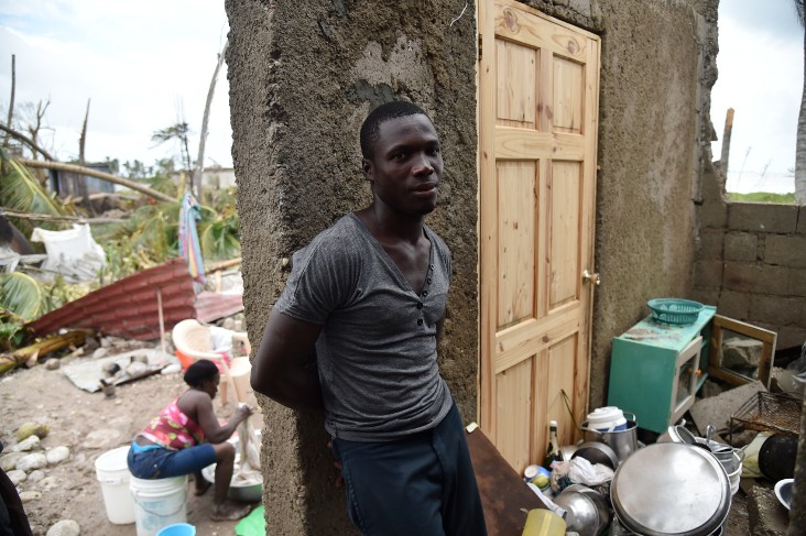 Stanley stands in his destroyed house after the passing of Hurricane Matthew, in Croix Marche-a-Terre, in Southwest Haiti