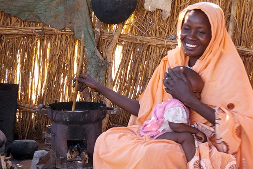 Mariam Hammed cooking in her home in El Fasher, North Darfur.