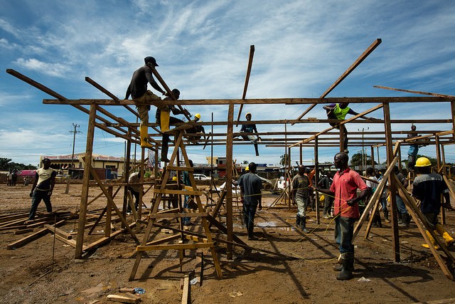 Construction crews work quickly to build a new Ebola Treatment Unit for a growing number of patients