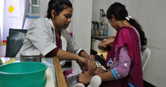 A child gets immunized in Bangladesh