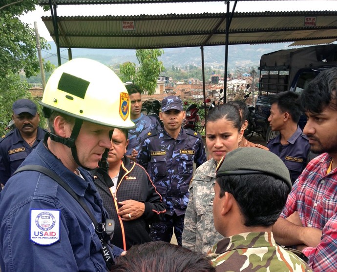 Mike Davis, a member of USAID’s Disaster Assistance Response Team, speaks with the Nepalese Army and the community in Bhaktapur,