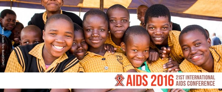 A group of young boys smile at the camera. AIDS 2016