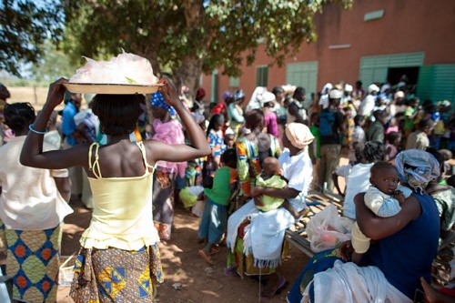 Children and young adults line up to receive MenAfriVac™ in the village of Koubri, Burkina Faso.