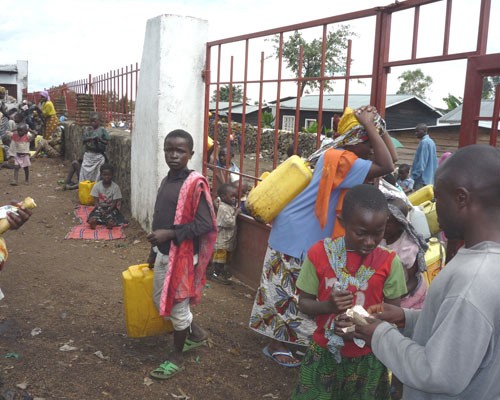People buy water at an official sale point in Goma.