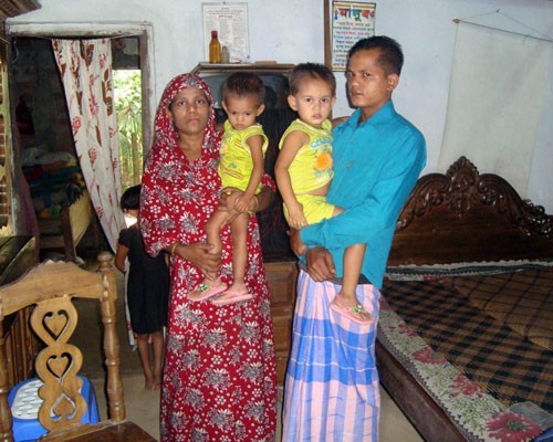 Laily Begum, left, pictured here with her husband and two young daughters, is one of 5,000 women in Bangladesh who have particip