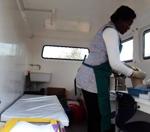 Dr. Ruth Jahonga prepares contraceptive implants inside the health wagon.
