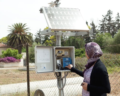 A technician from the Ministry of Agriculture tests a weather station installed by USAID in the Moulouya irrigated perimeter in 