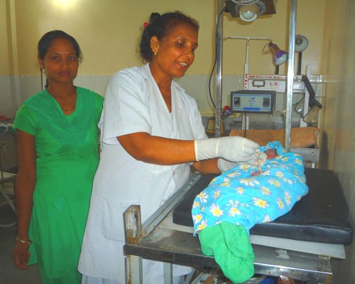 Application of chlorhexidine to the cord of a newborn baby in Banke district.