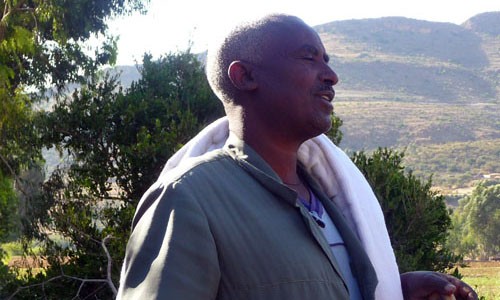 Orthodox Priest Berihu Gebremichael, a local beneficiary, community leader, father and farmer at the Awda Guanda watershed site,