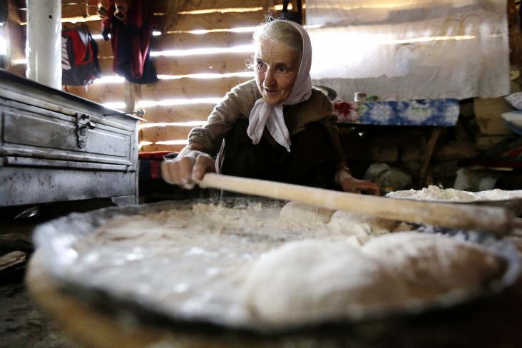A woman in Bosnia and Herzegovina makes traditional bread.