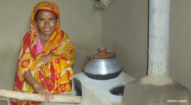 Image of woman in Bangladesh using modified clean cook stove