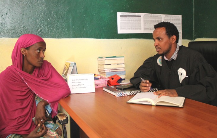 Zelalem Michael, right, gives legal assistance to Asha Adem at the Harar Legal Aid Center.