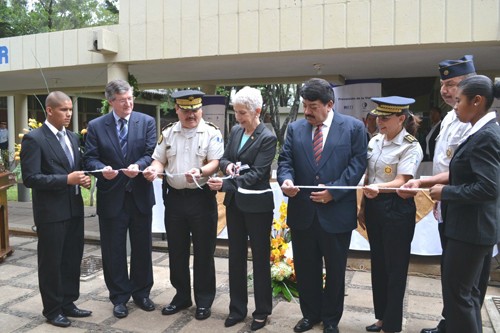 Police Reform Commissioner Adela de Torrebiarte, middle, cuts the ribbon at the launch ceremony of Guatemala’s bachelor’s degree