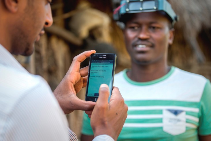 A member of the Global Trachoma Mapping Project team uses a smart phone to log data.