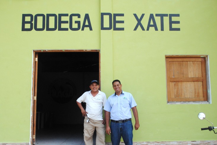 Melvin Barrientos, left, and Elmer Salazares of the Association of Forest Communities of Petén stand outside the xate bodega.