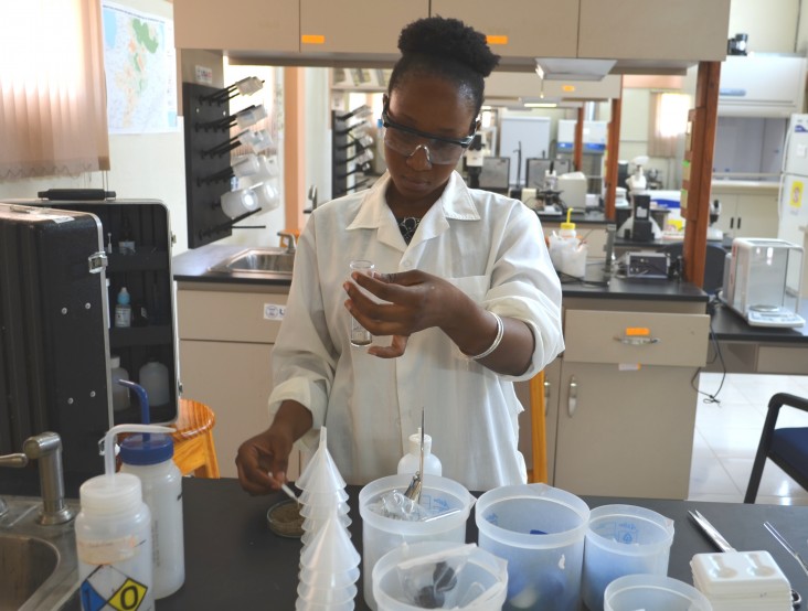 Viola Sylvestre, a lab tech at the Rural Center for Sustainable Development, tests a soil sample for local farmers.
