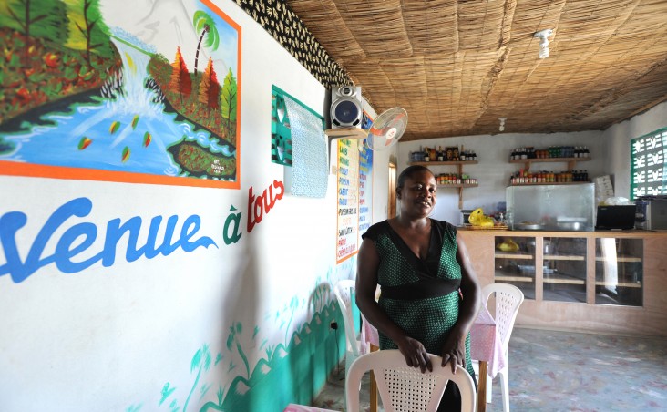 Achille Amiotte stands inside her restaurant in Caracol, Haiti, in May 2013.