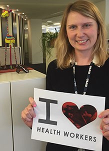 Diana celebrating Health Worker Week 2015 with a sign that says I love health workers
