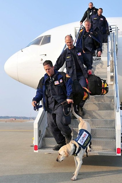 Search and rescue teams deployed by USAID arrive in Japan to assist victims of the 2011 earthquake and tsunami. 
